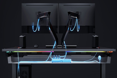 X-ray image of clean cables through the standing desk's cable management tray and MAGNUS Monitor Arms